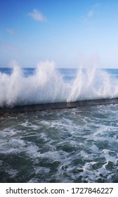 Crashing Waves Against A Tidal Pool Wall In St James, Cape Town.