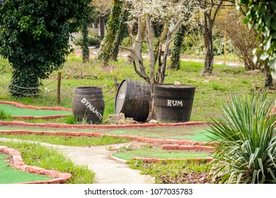 Crate And Barrel With Rum And Dynamite On A Mini Golf