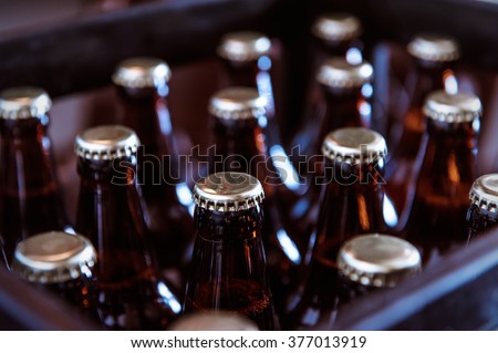 Crate with full beer bottles