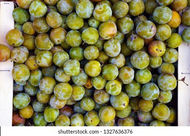 Crate Of Geen Gage Plums (reine Claude) At A Farmers Market