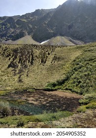 The Crater Of An Extinct Volcano Among The Siberian Mountains Located In The Valley Of Volcanoes, In Siberia