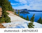 Crater Lake with Snow and Evergreen Trees Aerial Perspective