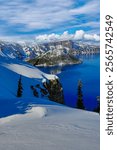 Crater Lake and Wizard Island in Crater Lake National Park in the winter season with snow