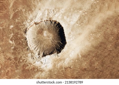 Crater from a meteorite, from space. Elements of this image furnished by NASA. High quality photo