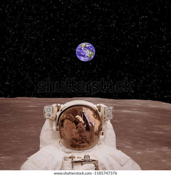 Craters, planet\
surface. Moon. Astronaut standing against camera. Elements of this\
image furnished by\
NASA\
