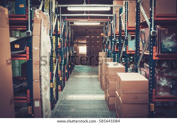 Crates and boxes on\
a shelves in a warehouse
