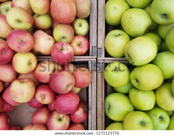 Crates of\
red and green apples at the farmer\'s\
market