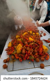 Crawfish Boils. Louisiana, New Orleans Crawfish Boil. Crawfish, Shrimp, Lobster, Seafood, Corn On The Cob, Sausage, Potatoes Boiled In Cajun Seasonings And Herbs. Classic Cajun Or Creole Cuisine.