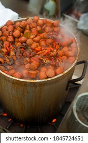 Crawfish Boils. Louisiana, New Orleans Crawfish Boil. Crawfish, Shrimp, Lobster, Seafood, Corn On The Cob, Sausage, Potatoes Boiled In Cajun Seasonings And Herbs. Classic Cajun Or Creole Cuisine.