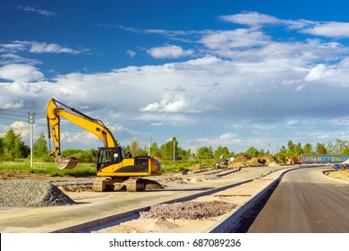 Crawler Excavator Digging Bucket On Construction Of High-speed Bypass Road Around Krasnoe Selo, Saint Petersburg. Heavy Machine Equipment For Excavation Works At Civil Industrial Construction. Russia