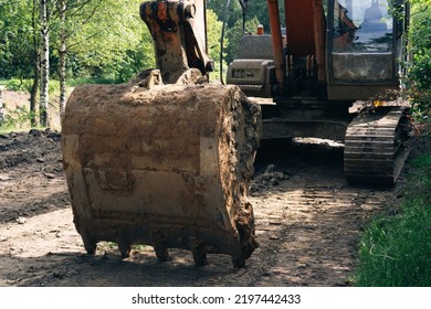 Crawler Excavator With Dirty Bucket, Close Up.