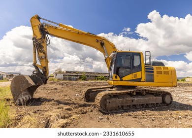 Crawler excavator front view digging on demolition site