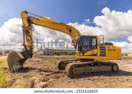 Crawler excavator front view digging on demolition site