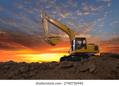 Crawler excavators  are digging the soil in the construction site. With  sky and clouds of on sunset background