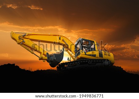 Crawler Excavators are digging the soil in the construction site on the  sunset  sky background