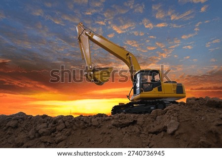Crawler excavators  are digging the soil in the construction site. With  sky and clouds of on sunset background
