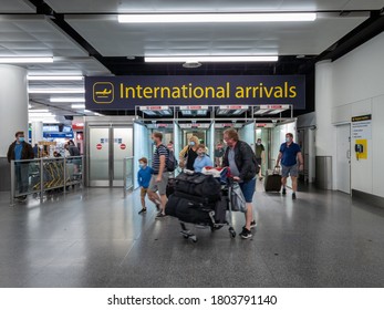 Crawley, Sussex, UK- 08.23.2020: Air Passengers Exiting The International Arrivals Gates In Gatwick Airport North Terminal.