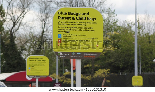 Crawley West Sussex UK 30th April 2019 : Signage in my
local supermarket car park. Disable parking and child bay
information   