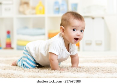 crawling funny baby boy indoors at home - Shutterstock ID 237693388