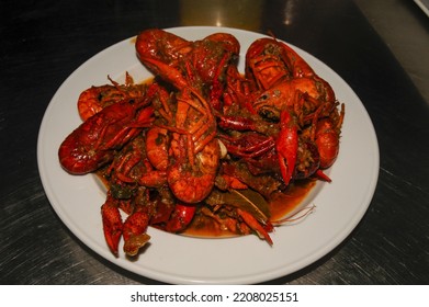 Crayfish Are Cooked In Water In A Saucepan On The Kitchen Stove, Crayfish Are Red From Cooking