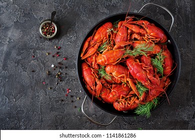Crayfish. Red boiled crawfishes on table in rustic style, closeup. Lobster closeup. Border design. Top view. Flat lay.