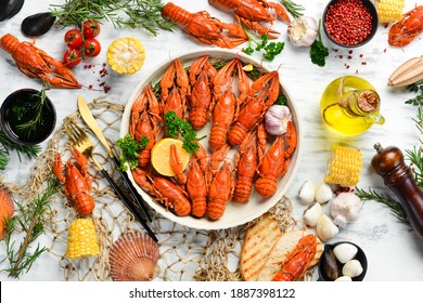 Crayfish. Red boiled crawfishes on table in rustic style, closeup. Lobster closeup. Seafood. Top view. Flat lay.