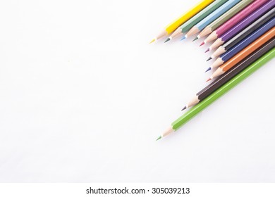 Crayon heart    Half Heart shape made colored pencils white background