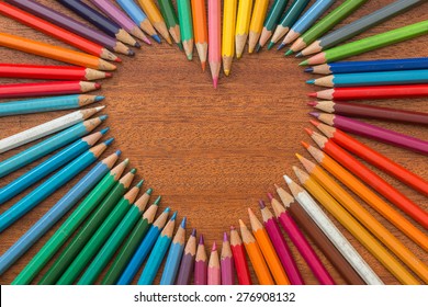 Crayon heart - Heart shape made of colored pencils - Powered by Shutterstock