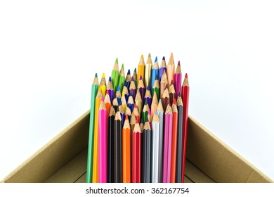 Crayon put in the box with white background./ Colored pencils 
