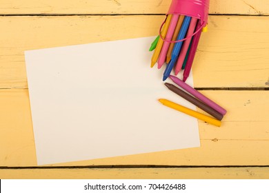 Crayons And Blank Page On The Desk