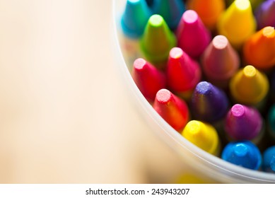 Crayons shot from above with shallow depth of field for dreamy impressional feel .