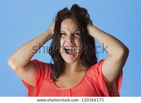 Crazed and Frustrated Woman pulling her hair