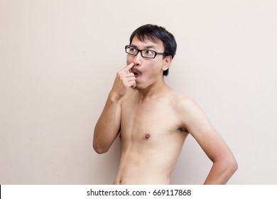 A Crazy Asian Glassed Man Naked And Pick His Nose In Public