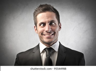 Crazy businessman making funny faces