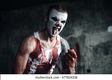 Crazy Clown Holding An Ax In His Hands