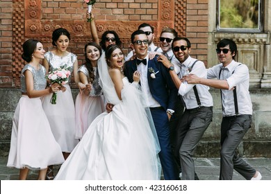 Crazy Couple And Bridesmaids With Groomsmen Behind