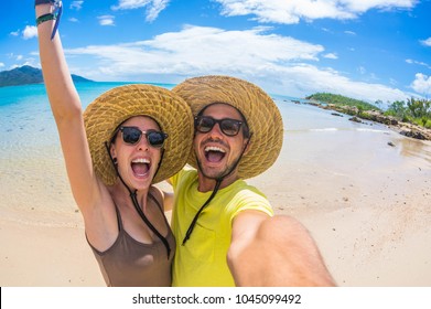 Crazy Couple In Love Having Fun Taking A Selfie At A Tropical Beach At Holiday