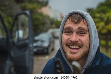 Crazy deranged man with long pruning scissors in his hands attacking wildly towards the camera. Crazy man attacking with scissors