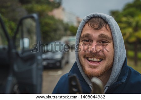 Crazy deranged man with long pruning scissors in his hands attacking wildly towards the camera. Crazy man attacking with scissors