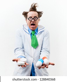 Crazy doctor with pills in hand