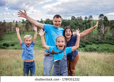 Crazy Family Portrait. Middle Aged Parents With Two Siblings Having Fun And Making Selfie During Local Travel At Summer Vacation, Active Lifestyle Outdoor