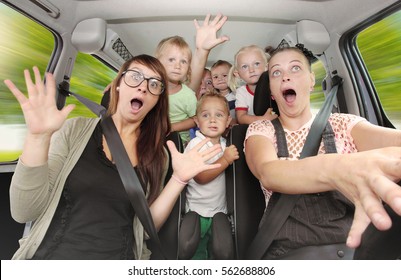 Crazy Family Taking A Selfie And Going To Holidays. Group Of People Enjoying Life In A Car. Free Time And Transportation Theme.