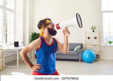 Crazy Fan Shouting In Megaphone, Cheering And Supporting Favorite Team And Celebrating Their Victory. Funny Man Announcing Fitness Goods Store Sale Or Promoting Sports Event Or Competition