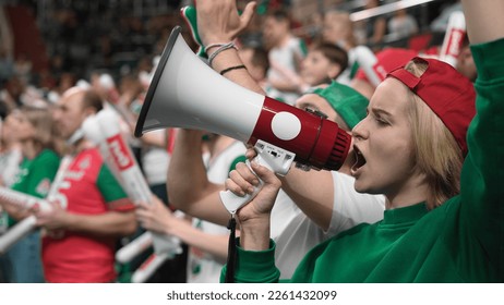 Crazy fan win goal bet. Happy mad woman scream megaphone bullhorn. Smile girl sport game cup. Joy female shout loudspeaker close up. Wild loud megaphone yell. Bully view hard play. Enjoy entertainment - Shutterstock ID 2261432099