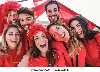 Crazy Football Fans Having Fun Outside Stadium For Soccer Match - Focus On Center Girls Faces