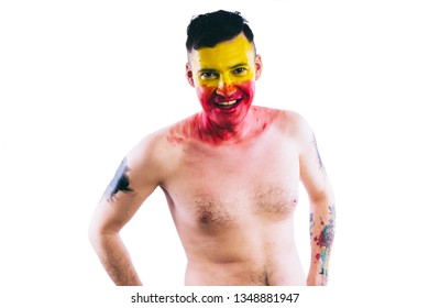 Crazy Guy Posing With A Painted Face. A Bizarre Portrait Of A Man With A Painted Body. Concept: Sports Fan, Isolated On White Background