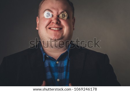 crazy happy bitcoin male lover with golden coin by eyes