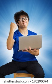 Crazy Happy Guy With Computer Laptop On Blue Background