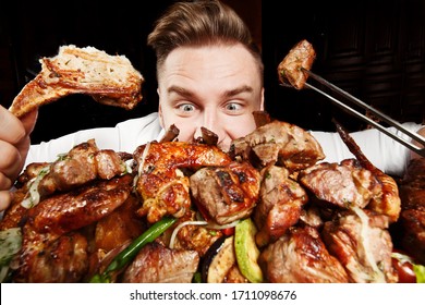 Crazy Hungry Man Eating Mix Grill Meat. Emotional Content For Restaurant Promo. Cheat Day. Meat Lover. Lamb Chops, Chicken Tikka, Kebab, Lamb, Beef Steak. 