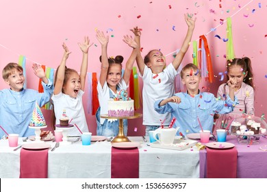 Crazy Kids Having A Cool Party, Idolated Pink Background, Studio Shot, Celebration